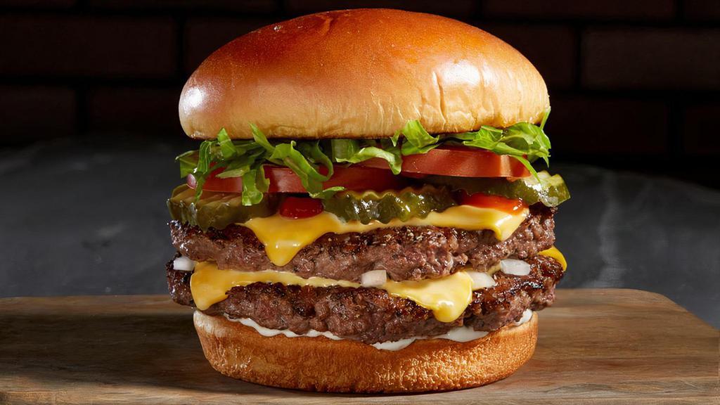 Manhattan Burger · One or Two, 4 oz. fresh Angus Beef patties, lettuce, tomato, onion, crunchy pickle chips, mayo, ketchup and american cheese.