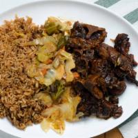 Oxtails · Served with choice of rice cabbage and plantains.