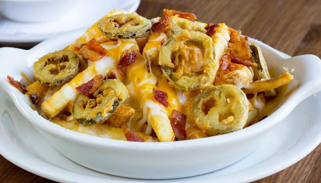 Cheese Fries · Crispy seasoned French fries topped with mixed cheeses, bacon, and fried jalapeños with ranch.