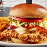 Fried Chicken Sandwich · Buttermilk marinated chicken, provel cheese, bacon, honey mustard, lettuce and tomato on a b...