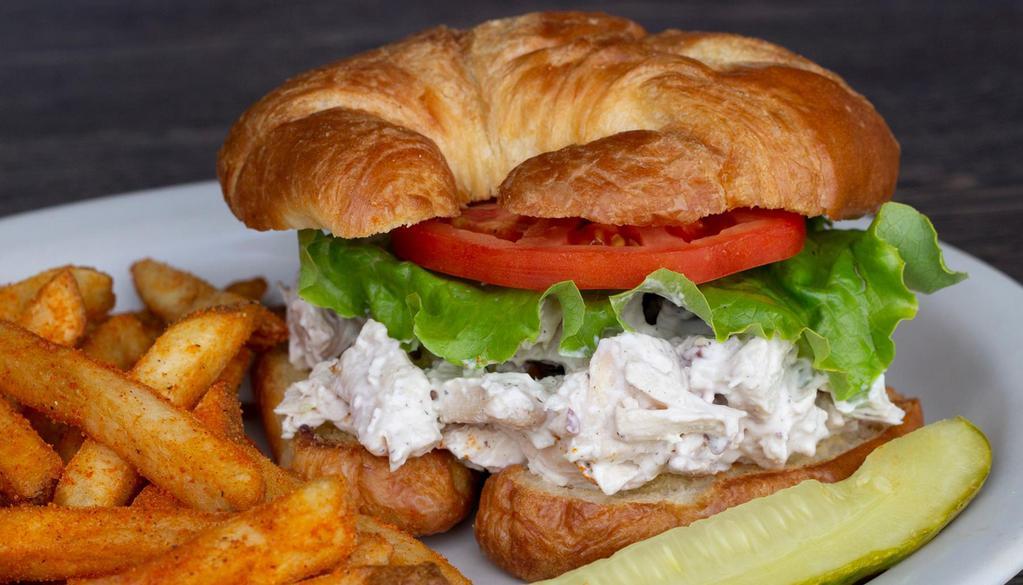 Chicken Salad Croissant · Roasted chicken, chopped pecans, grapes, celery and mayo served on a flaky croissant with lettuce and sliced tomato.