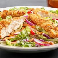 Chicken Tender Salad · Buttermilk marinated chicken tenders
over greens, cucumbers, tomatoes,
shredded carrots, red...