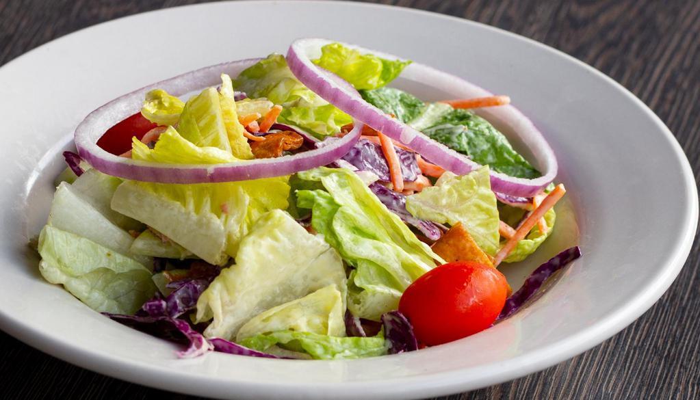 House Salad  · Mixed greens, cucumbers, tomatoes, shredded carrots, radishes, red onions and tortilla crunch tossed in our honey mustard dressing