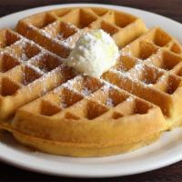 Belgian Waffle · Thick and light, a true Belgian waffle. Topped with powdered sugar.