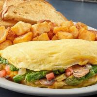 Veggie Omelet · Mushrooms, onions, peppers, cheddar cheese, asparagus and tomatoes. Served with toast and yo...