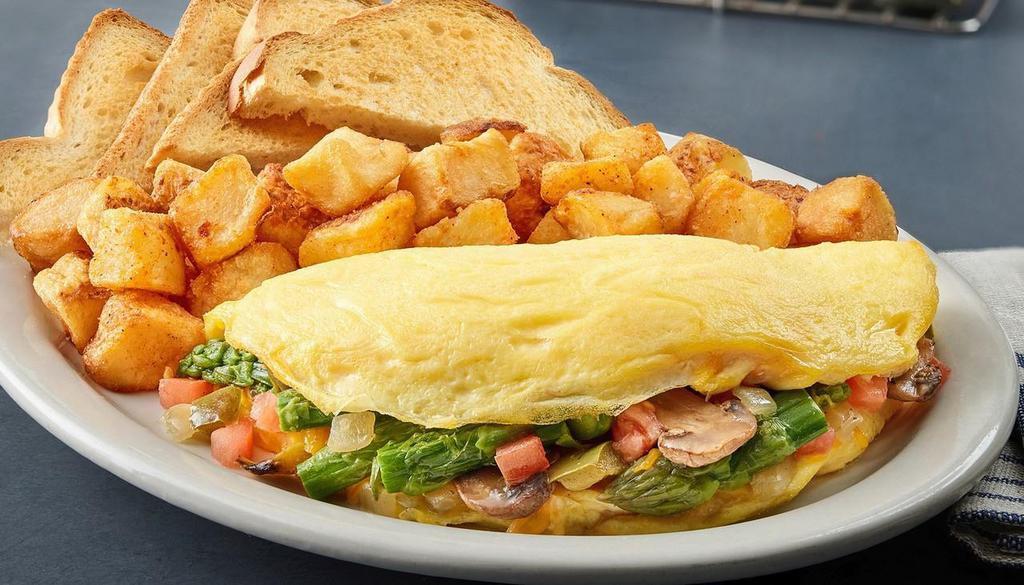 Veggie Omelet · Mushrooms, onions, peppers, cheddar cheese, asparagus and tomatoes. Served with toast and your choice of hashbrowns or grits.