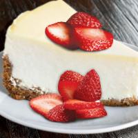 Strawberry-Topped Cheesecake  · Classic cheesecake topped with strawberries.