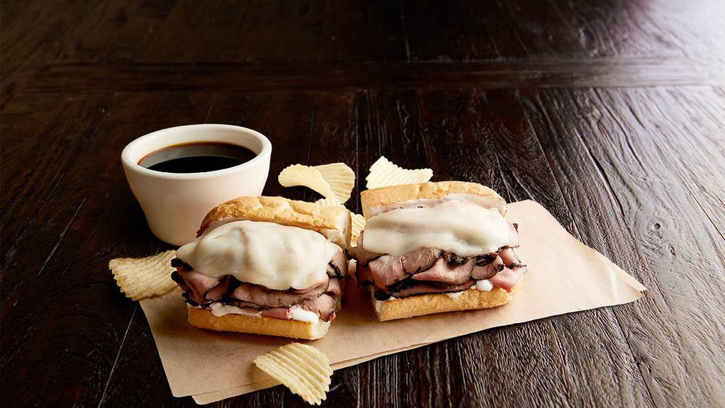 Beefeater Regular · 1/2 pound of hot roast beef, provolone, mayo, toasted on New Orleans French bread. Served with a cup of au jus. Served with chips or baked chips (150/100 cal) and a pickle (5 cal).