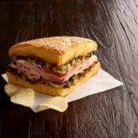 1/4 Ham & Salami Muffaletta Special (630-1060 Cal) · Grilled, crusty Muffaletta bread is spread to the edges with our family-recipe olive mix wit...