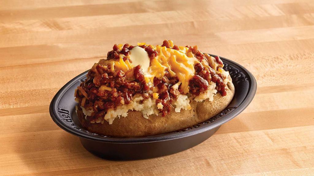 Texas Style Spud Original · Chopped pit-smoked beef brisket, barbecue sauce, cheddar, butter on a baked potato.