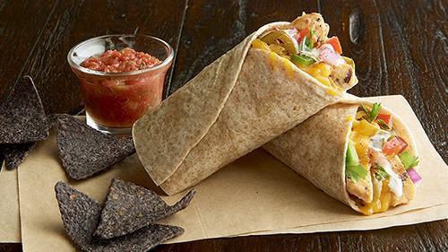 Ranchero Wrap  · Grilled, 100% antibiotic-free chicken breast, cheddar, jalapeños, pico de gallo, Southwest spices, ranch dressing, toasted in an organic wheat wrap. Served with blue corn chips and salsa.