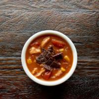 Cup Fire Roasted Tortilla Soup · Combining chunks of tender chicken with a homemade tortilla masa, real stewed tomatoes, swee...
