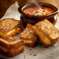 Grilled Cheese & Tomato Soup Combo · It's Back! Grilled Muenster and cheddar cheese sandwich on multigrain wheat. Served with a b...