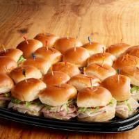Deli Sliders Tray (3750 Cal) · Cold, mini sandwiches on potato slider buns; 12 Roasted Turkey Sliders & 12 Ham-Salami Slide...