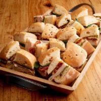 Mini Tuscan Focaccia Tray (2910 Cal)  · Roasted turkey breast, roasted tomatoes, pesto aioli and Asiago mini sandwiches are paired w...