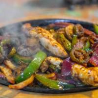 Chicken Fajitas (Enough For 2 People) · Chicken breast meat grilled with onions and bell peppers, served with soft tortillas, guacam...