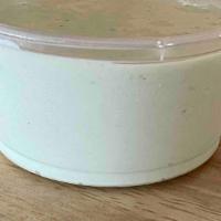 Side Jalapeno Crema · a small side of our slightly spicy crema we make in house that is used to top our rajas, que...