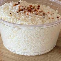 Side Cotija Cheese · small side of cotija cheese. This hard, salty, crumbly Mexican cheese is made mainly from co...