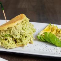 Reina Pepiada · Arepa filled with avocado cream mixed with shredded chicken (served cold) / Arepa rellena de...