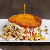 Grilled Chicken Breast Patacon · Plantain sandwich filled with grilled chicken breast, pico de gallo, ketchup, green sauce an...