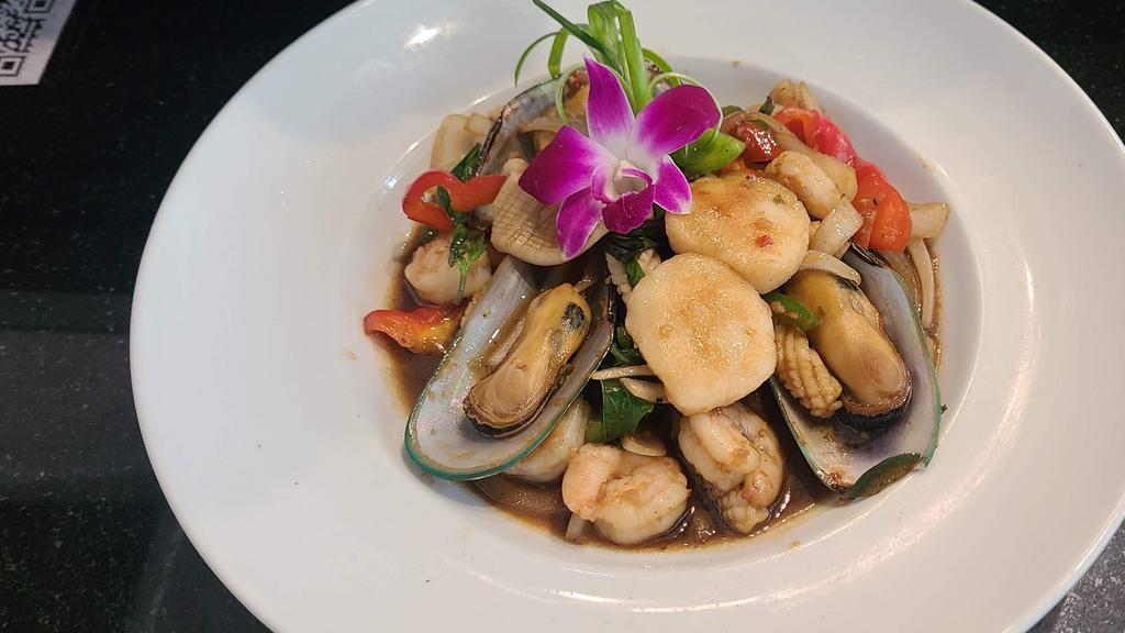 Spicy Basil With Mixed Seafood · Stir fired with red onion, bell peppers, Thai basil leaves with shrimp, scallop, mussel, calamari with spicy basil sauce