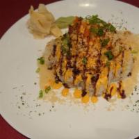 Spicy Mountain Tuna Roll · Spicy tuna, cucumber inside, spicy crab, temp flake, masago on top with eel sauce, spicy mayo