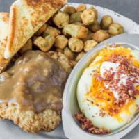 Country Fried Steak · Smothered and covered in brown gravy served with 2 sides and a piece of toast.