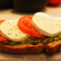 Caprese Avocado Toast · Freshly baked Multigrain toast, avocado, fresh mozzarella, tomato