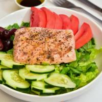 Salmon Salad · Grilled Wild Alaska Salmon, Romaine lettuce, tomatoes, cucumbers, herbs, lemon