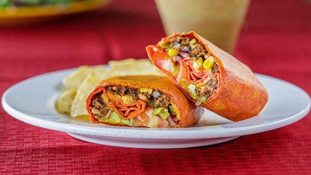 Grilled Slow Joe Western Wrap · Black bean burger, tomatoes, red onions, grilled jalapenos, pepper jack, cheddar, or vegan cheese, avocado, and sweet and tangy sauce.