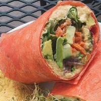 Hummus And Avocado Wrap · Organic spring mix, hummus, a whole avocado, cucumbers, tomatoes, red onions, carrots, and r...