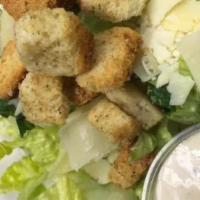 Classic Caesar Salad · Tossed romaine, shaved parmesan, croutons, and tossed with caesar dressing.