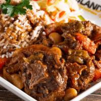Oxtails (Large) · Our Oxtails is very delicious. Served with steamed cabbage and your choice of white rice or ...