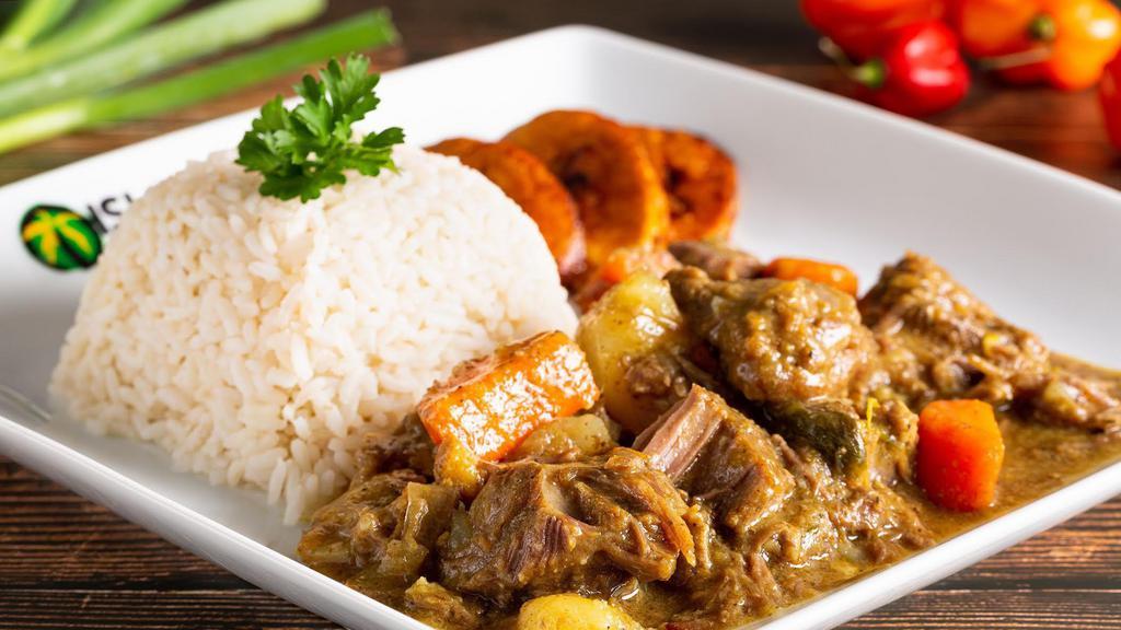 Curry Goat (Large) · Our Curry Goat is very delicious. Served with steamed cabbage and your choice of white rice or rice and peas.