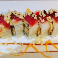 Red Dragon · Shrimp tempura, eel, cucumber, scallion avocado, i/o tuna, spicy mayo, eel sauce, tempura fl...