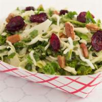 Kale Slaw · Shredded Kale & Cabbage, Candied Pecans, Dried Cranberries, Honey Mustard Poppy Seed Dressing.