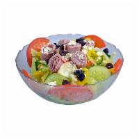 Larry'S Famous Greek Salad · Garden salad topped with feta cheese, greek olives, premium ham, pepperoncinis and our own g...