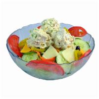 Sally Sherman All White Meat Chicken Salad · Garden salad topped with chicken blended with hellmann's real mayonnaise.