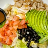 Cobb Salad · Spring mix greens, topped with diced egg, avocado, blue cheese crumbles, cucumbers, tomatoes...
