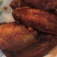 Chicken Wings · Sauces: Mild, Medium, BBQ, Teriyaki Glaze, Lemon Pepper, Garlic Parm, or Mango Habanero