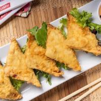 Crispy Crab Wontons · Stuffed with krabmeat and cream cheese filling, studded with green onion and jalapeno, and s...