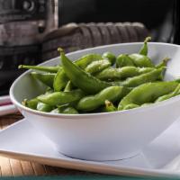 Edamame · Soybeans steamed in their pods and lightly salted. Eat 'em with your fingers.