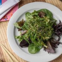 Seaweed Salad · Sweet and savory wakame seaweed and sesame seeds on spring mix.
