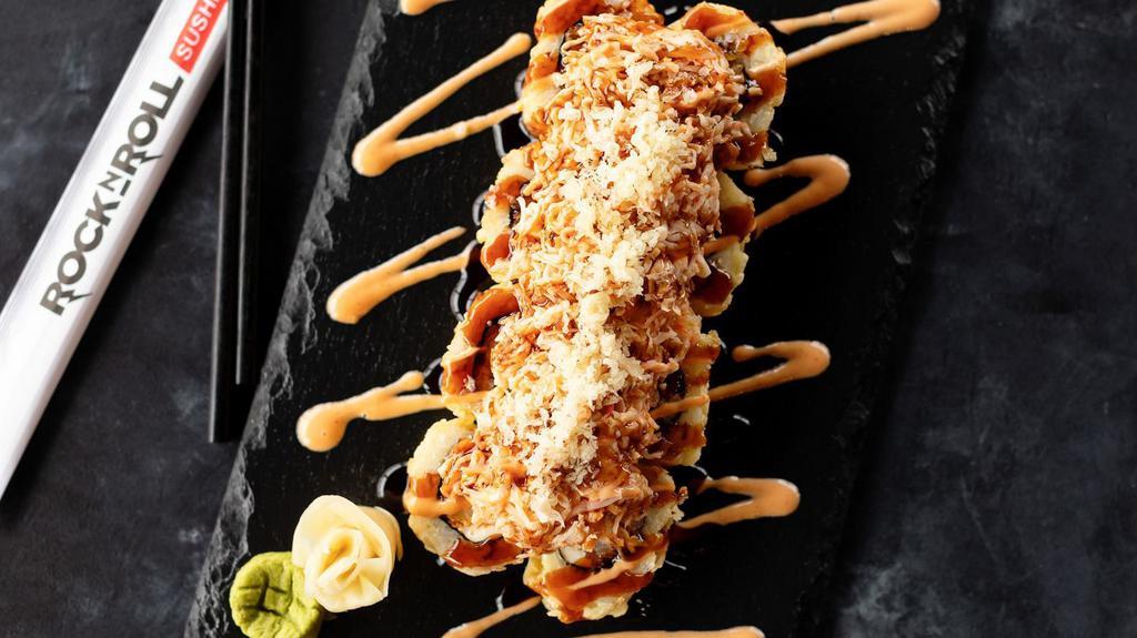 Thriller Roll · Shrimp tempura and cream cheese. Deep-fried and topped with baked crabmeat, shrimp, spicy mayo, eel sauce, and crunchy flakes.