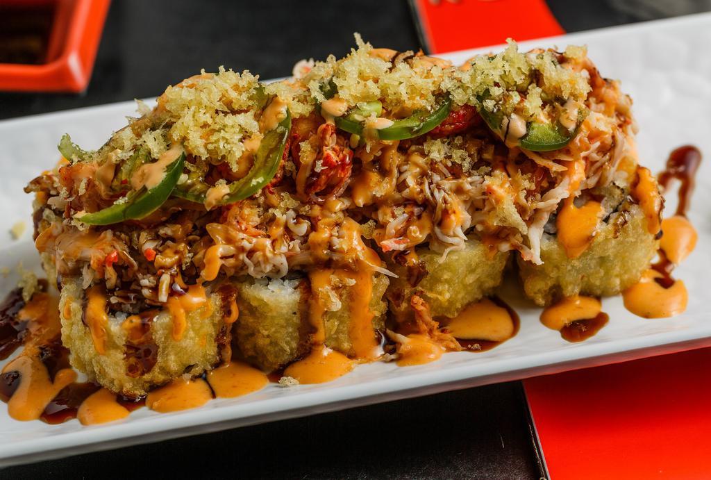 Vip Roll · Shrimp tempura, crab meat, and cream cheese. Served fried or baked. Topped with baked crab meat, seasoned crawfish, jalapeños, spicy mayo, eel sauce, sweet chili sauce, and crunchy flakes.
