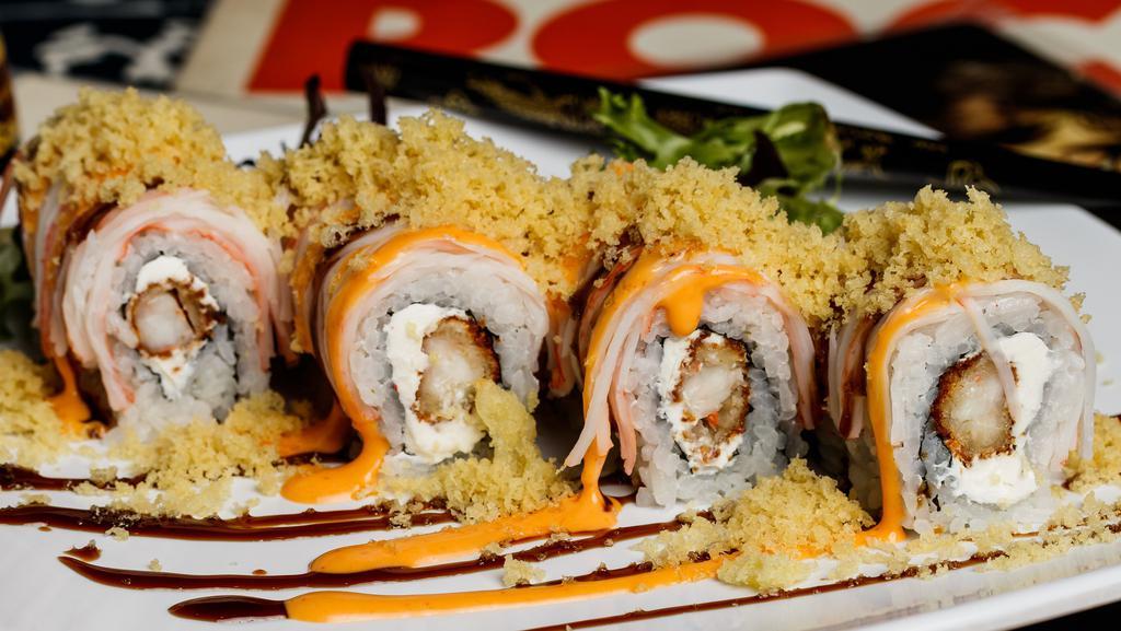 Metalhead Roll · Enter delicious. Shrimp tempura and cream cheese inside, crab stick outside, topped with spicy mayo, eel sauce and crunchy flakes.