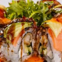 British Invasion Roll · Shrimp tempura, crab stick, cream cheese and cucumber inside, smoked salmon, baked eel and a...