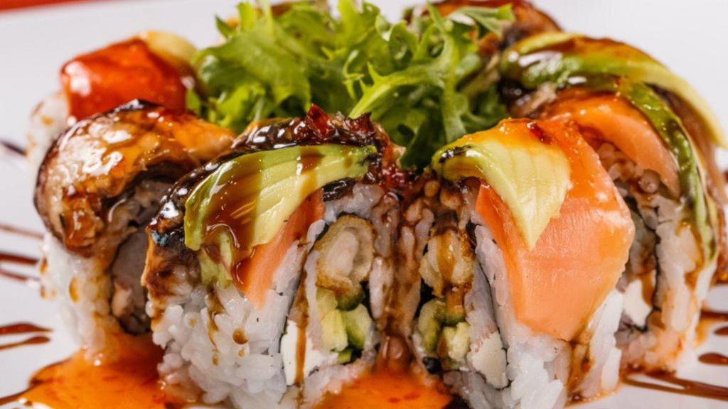British Invasion · Shrimp tempura, crab meat, cucumbers, and cream cheese. Topped with baked eel, smoked salmon, avocado, eel sauce, sweet chili sauce, and sesame seeds.