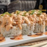 Electric Roll · Cajun-seasoned crawfish and crab stick inside. Topped with baked krabmeat, jalapeños, eel sa...