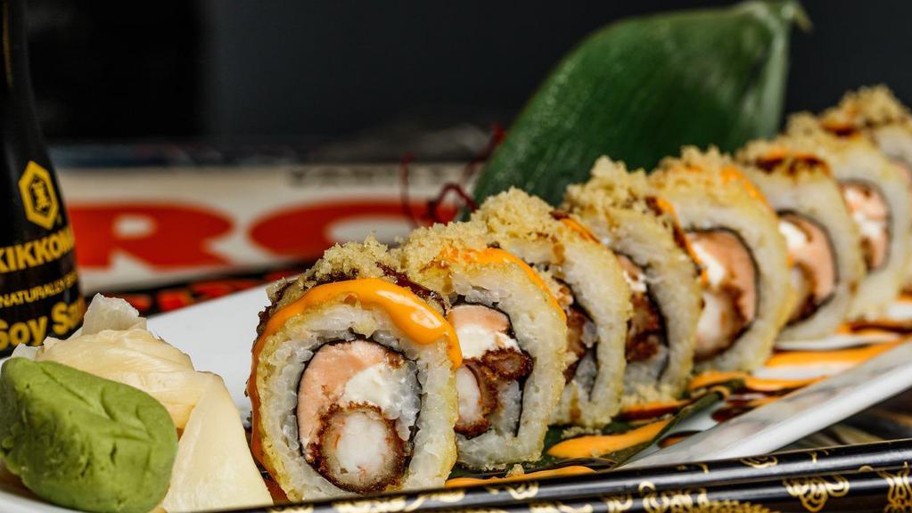 Axl Roll · Shrimp tempura, salmon and cream cheese inside, fully fried, topped with spicy mayo, eel sauce and crunchy flakes. Named for a true rockstar-our founders' son.